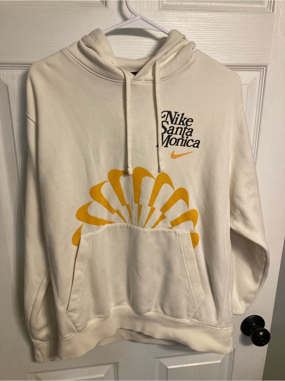 Nike Cream Hoodie with Yellow Graphic and Santa Monica Logo